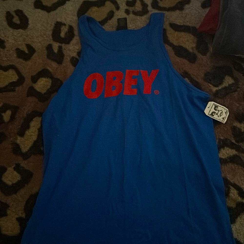 A blue obey tank top red logo